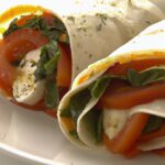 Fresh Tomato & Mozzarella Wrap with Zesty Pesto Twist