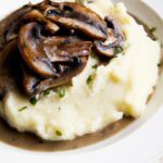 Creamy Mashed Potatoes Perfected with Savory Mushroom Gravy